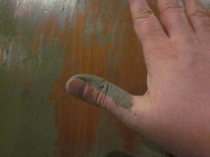 picture showing paint coming off the end table onto my thumb