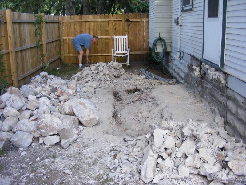 Stoop gone. The rocks and bits of concrete you can see are only a small part of the total