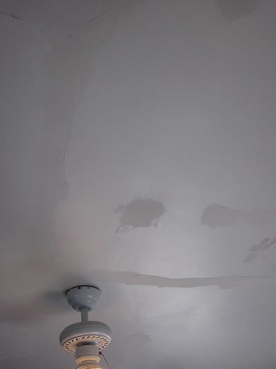 Ceiling plaster patches awaiting sanding. Is it just me who sees a sad clown face in this picture?