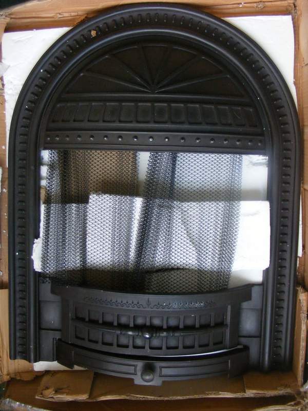 This is the metal fire surround we chose, pictured here lying on its packaging.